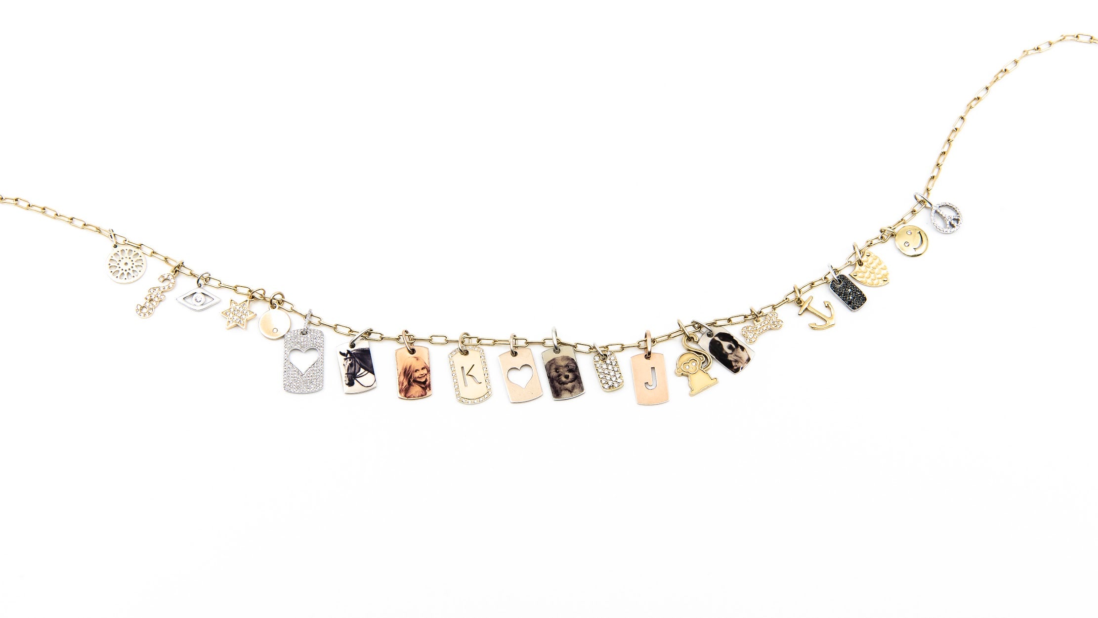 Worn on small gold link chain with  customized charms 